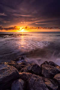 Scenic view of sea against sky during sunset