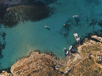 High angle view of rocks in sea