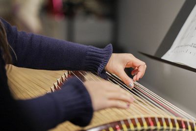 Close-up of hands playing guitar