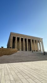 Low angle view of building against clear blue sky