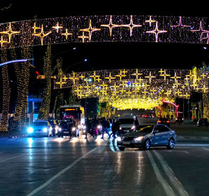 Illuminated city street at night