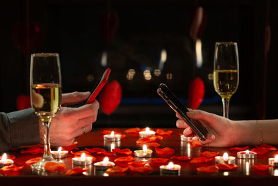 Close-up of wine glasses on table