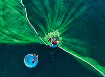 High angle view of woman swimming in sea