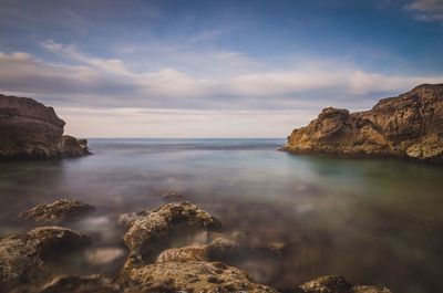 Scenic view of sea and cliff