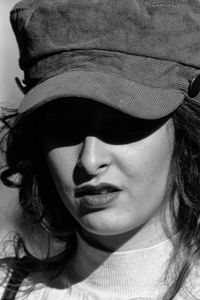 Close-up portrait of woman wearing hat