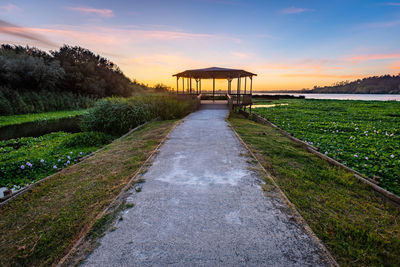 Scenic view of empty road against sky during sunset