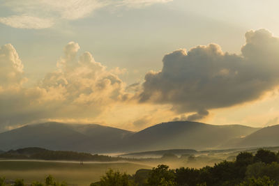 Scenic view of landscape against sky during sunset