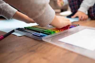 Close-up of multi colored pencils on table