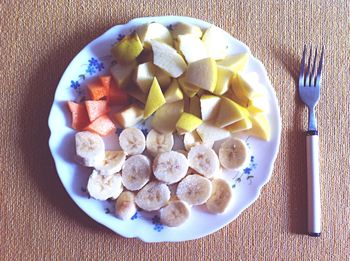 High angle view of fruits in plate on table