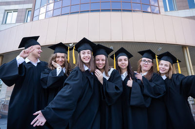 Portrait of woman wearing graduation gown