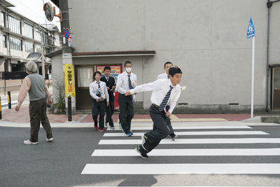 Group of people crossing road