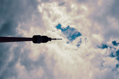 Low angle view of airplane flying against sky