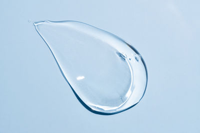 Close-up of crystal ball against blue background