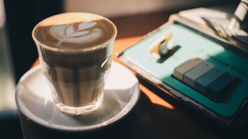 High angle view of coffee cup on table