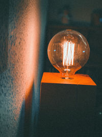 Close-up of illuminated light bulb