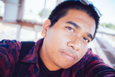 Close-up portrait of young man at home