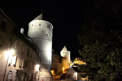 Illuminated buildings in city at night