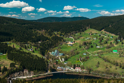 High angle view of green landscape against sky