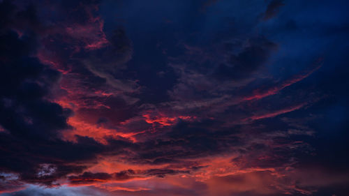 Low angle view of dramatic sky at sunset