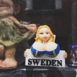 Close-up of figurine for sale at market stall