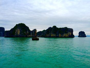 Scenic view of sea against cloudy sky