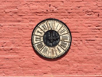 Close-up of clock on wall
