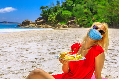 Woman wearing sunglasses on beach