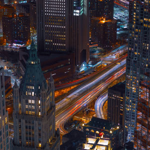 High angle view of illuminated buildings in city at night