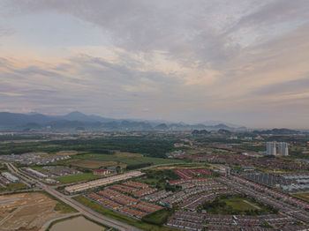 High angle view of cityscape against sky during sunset