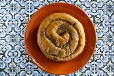 Top view of portuguese easter cake called folar algarvio de olhao on portuguese tiles background