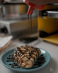 Close-up of hand holding ice cream
