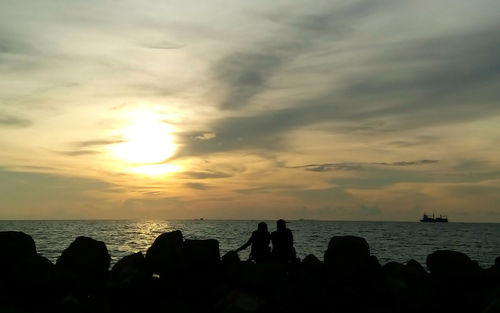 Scenic view of sea at sunset