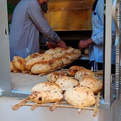 Cropped image of people preparing food