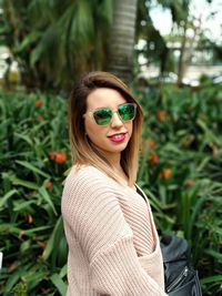 Portrait of young woman wearing sunglasses