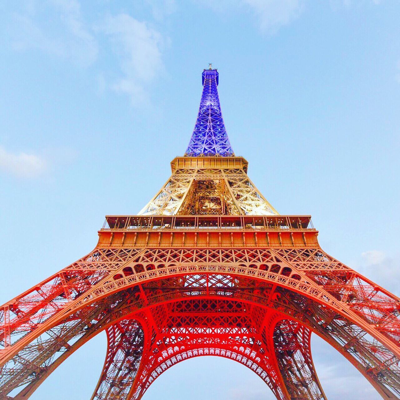 famous place, international landmark, travel destinations, low angle view, tourism, architecture, built structure, capital cities, blue, culture, sky, history, architectural feature, tall - high, day, outdoors, no people, cloud - sky, cloud