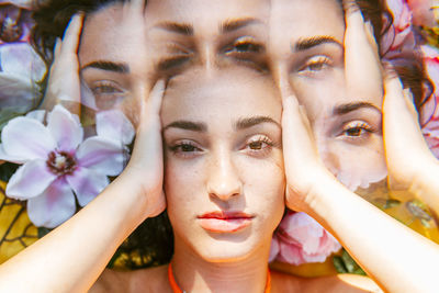 Multiple exposure of young woman with head in hands