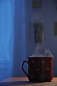Close-up of steam coming out from coffee cup