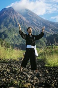 Full length of man standing on field