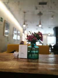 Flower vase on table in restaurant