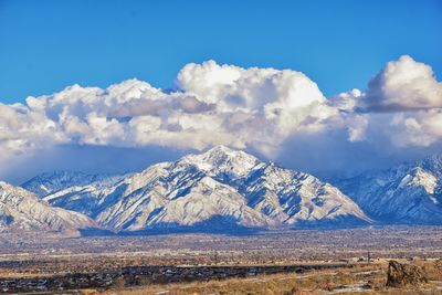 Scenic view of snowcapped mountains against sky