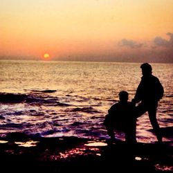 Scenic view of sea at sunset