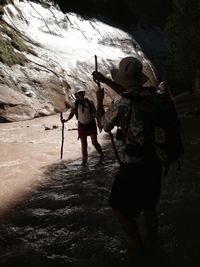 Full length of woman standing by railing