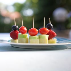 Close-up of fruits in plate on table