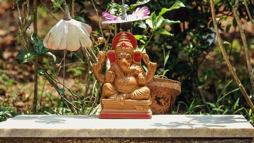 Close-up of statue against trees