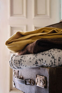 Close up of folded blankets on suitcase