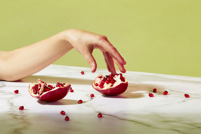 Midsection of woman with red fruits