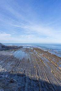 Scenic view of sea against sky during winter