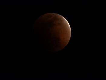 Low angle view of moon against clear sky at night