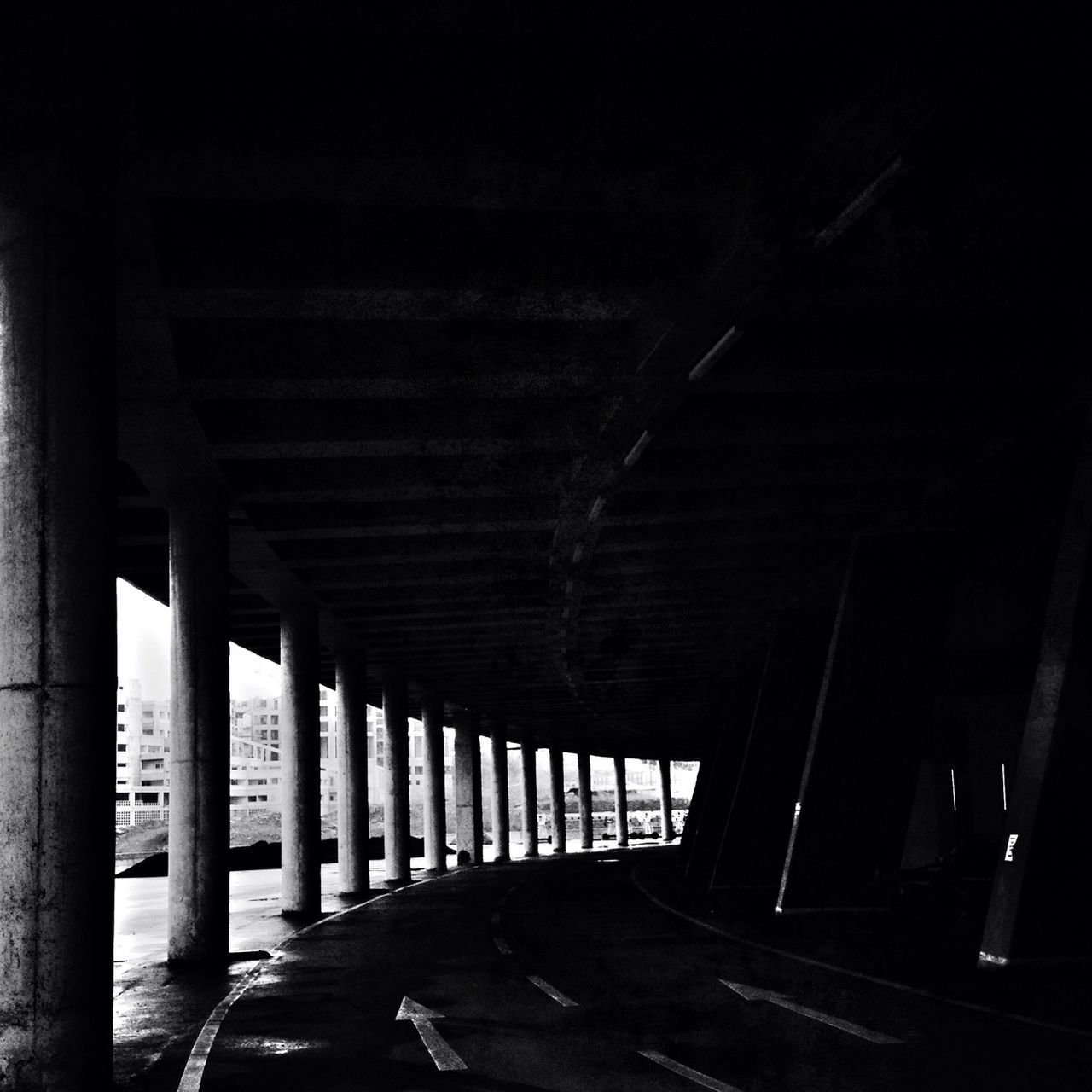 indoors, built structure, architecture, architectural column, column, the way forward, in a row, diminishing perspective, corridor, sunlight, support, colonnade, ceiling, bridge - man made structure, empty, pillar, day, shadow, railing, no people