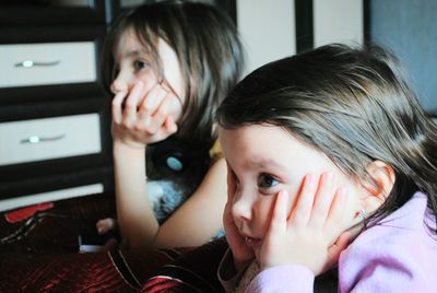 Close-up portrait of girls at home